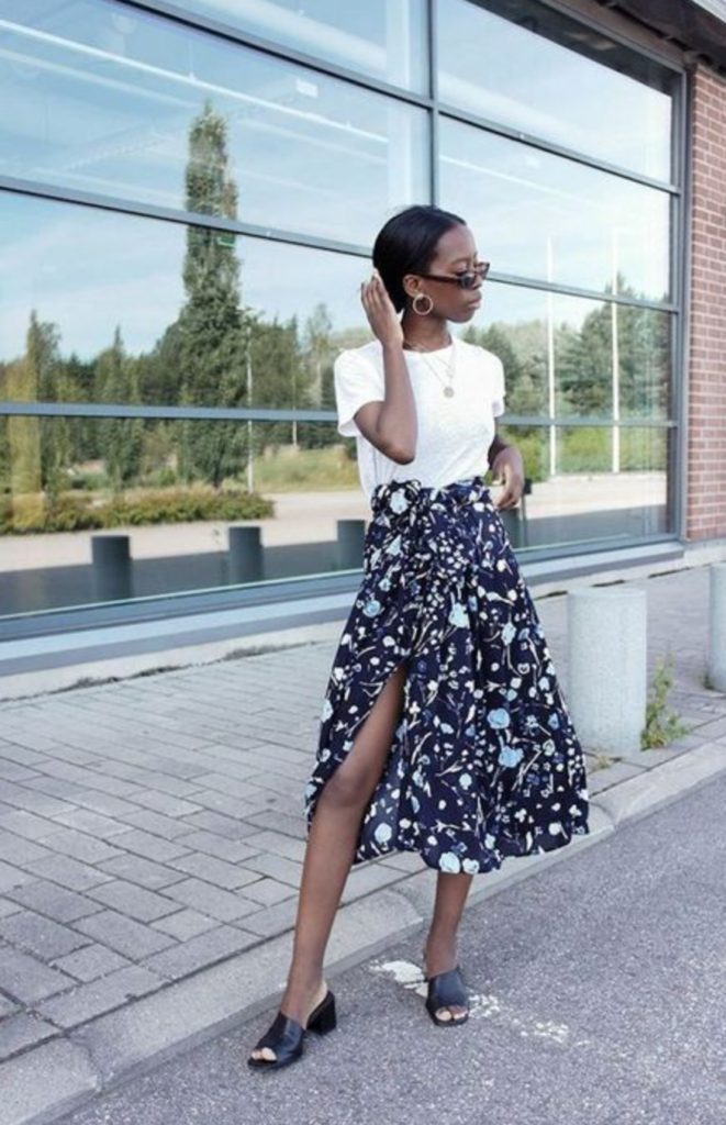 white tee styled with floral wrap skirt